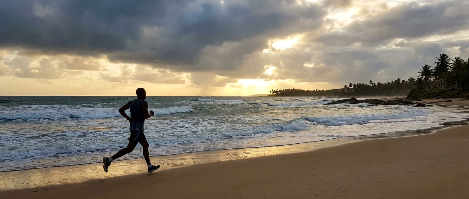 A determined individual runs along a vast, sun-drenched Brazilian beach, their silhouette prominent against the dramatic backdrop of dark, clearing storm clouds and crashing ocean waves. The scene captures a powerful sense of purpose and resilience despite challenging natural elements, composed for a wide, horizontal frame.